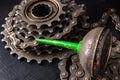 Oiling the bicycle chain with an oil can on the workshop table. Servicing of bicycle parts