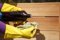 Oiling a new wooden raised garden bed