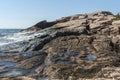 Oily coating on rocks on Narragansett Bay