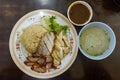 Oily Rice with BBQ Pork, Crispy Pork and Boiled Chicken. Served with Sauce and Soup