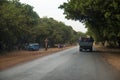 Group of people traveling in the back of a truck in the Oio Region of Guinea Bissau