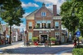 Street view of dutch picturesque town with old post office used as book store