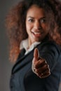 ok! Black woman's enthusiastic thumbs-up background joy blurred