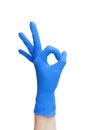 Ok sign made of blue medical gloves.