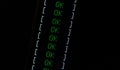 OK text on dark computer screen, task successful, system check completed, check list passed, computing positive outcome Royalty Free Stock Photo