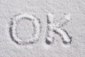 OK word symbol on snow