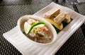 Oka - known as kokoda, poke, ceviche, or poisson cru - is Polynesian raw fish salad from Samoa, with taro chips Royalty Free Stock Photo