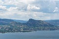 Okanagan lake at summer day with clouds on the sky.