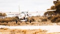 A Cessna 208 Caravan aircraft makes a landing on a bush strip in the Okavango Delta