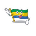 Okay flag gabon flown on mascot pole