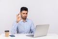 Okay! Happy optimistic businessman sitting office workplace, showing ok finger gesture, approving suggestion