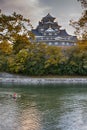 Okayama Crow Castle or Ujo Castle in Okayama City on the Asahi River in Japan. With Little Boat In Foreground