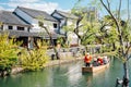 Old boat on canal at Kurashiki Bikan Historical Quarter in Okayama, Japan