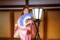 Tourists dressed into the Beautiful National Kimono in the Japanese Castle