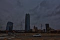 OKC as the sky dims with the Devon energy center and downtown skyline beginning to light up