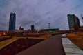 OKC as the sky dims with the Devon energy center and downtown skyline beginning to light up