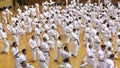 Okinawa, Japan - july 11, 2012: IOGKF World Budo sai. Group of people practicing karate kata.