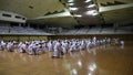 Okinawa, Japan - july 11, 2012: IOGKF World Budo sai. Group of people practicing karate sitting.