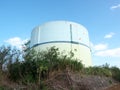 Big cylindrical water storage tank supplying water to the people in Irabu island, Japan Royalty Free Stock Photo