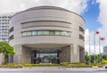 Okinawa prefectural office building in Japan with national flag