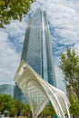 High-rise commercial building towering skyward beyond white steel pipe framework detail