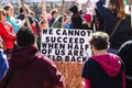 Womens March - protestors around sign that says We cannot succeed when half of us are held back