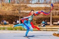 Sunny view of a woman dancer doing Chinese style dance