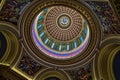 Oklahoma state capitol dome with paintings and ornate detail the state seal at the center of the dome