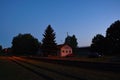 Okna, Ceska Lipa district, Czech republic - July 14, 2018: small train station, trees, parked cars during summer holiday evening