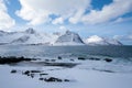 Okneset and Ersfjord from Tungeneset on a stormy day with breaking waves and spray. Sunny day in Mountains And Fjords, Winter