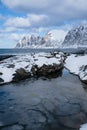 Okneset and Ersfjord from Tungeneset on a stormy day with breaking waves and spray. Sunny day in Mountains And Fjords, Winter