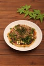 Okonomiyaki is a type of teppan-yaki using flour, chicken eggs, cabbage, sauce, etc.