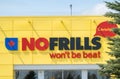 A close up to a No Frills sign. A Canadian chain of discount supermarkets, owned by Loblaw