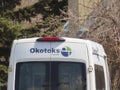 A close up to an Okotoks Public transit van