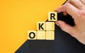 OKR, objectives and key results symbol. Concept words `OKR, objectives and key results` on cubes on a beautiful black background