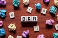 OKR- Objectives and Key Results,word concept on cubes