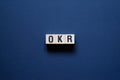Okr - objectives and key results,word concept on cubes