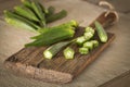 Okra. Vegeteble on a kitchen board, partly chopped