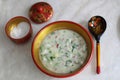 Okroshka. Traditional Russian summer cold soup with sausage, vegetables and kvass in bowl on wooden background. Top view Royalty Free Stock Photo