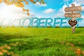 Oktoberfest Background Banner. Green meadow. Gingerbread heart . Destination panel. Sign post Royalty Free Stock Photo