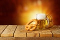 Oktoberfest background with beer and pretzel on wooden table Royalty Free Stock Photo