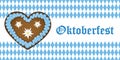 Oktoberfest banner with gingerbread heart on bavaria flag background blue and white Royalty Free Stock Photo