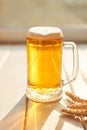 Oktoberfest beer. Glass beer mugs full of golden lager with thick frothy heads conceptual of Oktoberfest. Beer mug. Big glass of Royalty Free Stock Photo