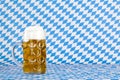 Oktoberfest beer stein and Bavarian flag