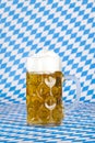 Oktoberfest beer stein and Bavarian flag