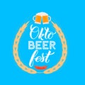 Oktoberfest calligraphy hand lettering on blue background. Traditional Bavarian beer festival. Easy to edit vector template for