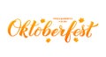 Oktoberfest calligraphy hand lettering with fall maple leaves. Traditional Bavarian beer festival. Easy to edit vector template