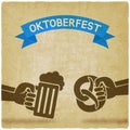 Oktoberfest concept. Hand with beer mug and pretzel old background