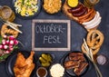 Oktoberfest dishes with beer, pretzel and sausage