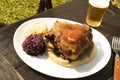 oktoberfest - eisbein german food in daylight, pork, sauerkraut and beer
